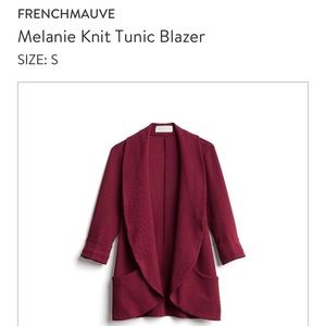 Burgundy-red jacket.